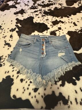 Celebrity Pink Light Wash Distressed Denim Fringe Hem Shorts